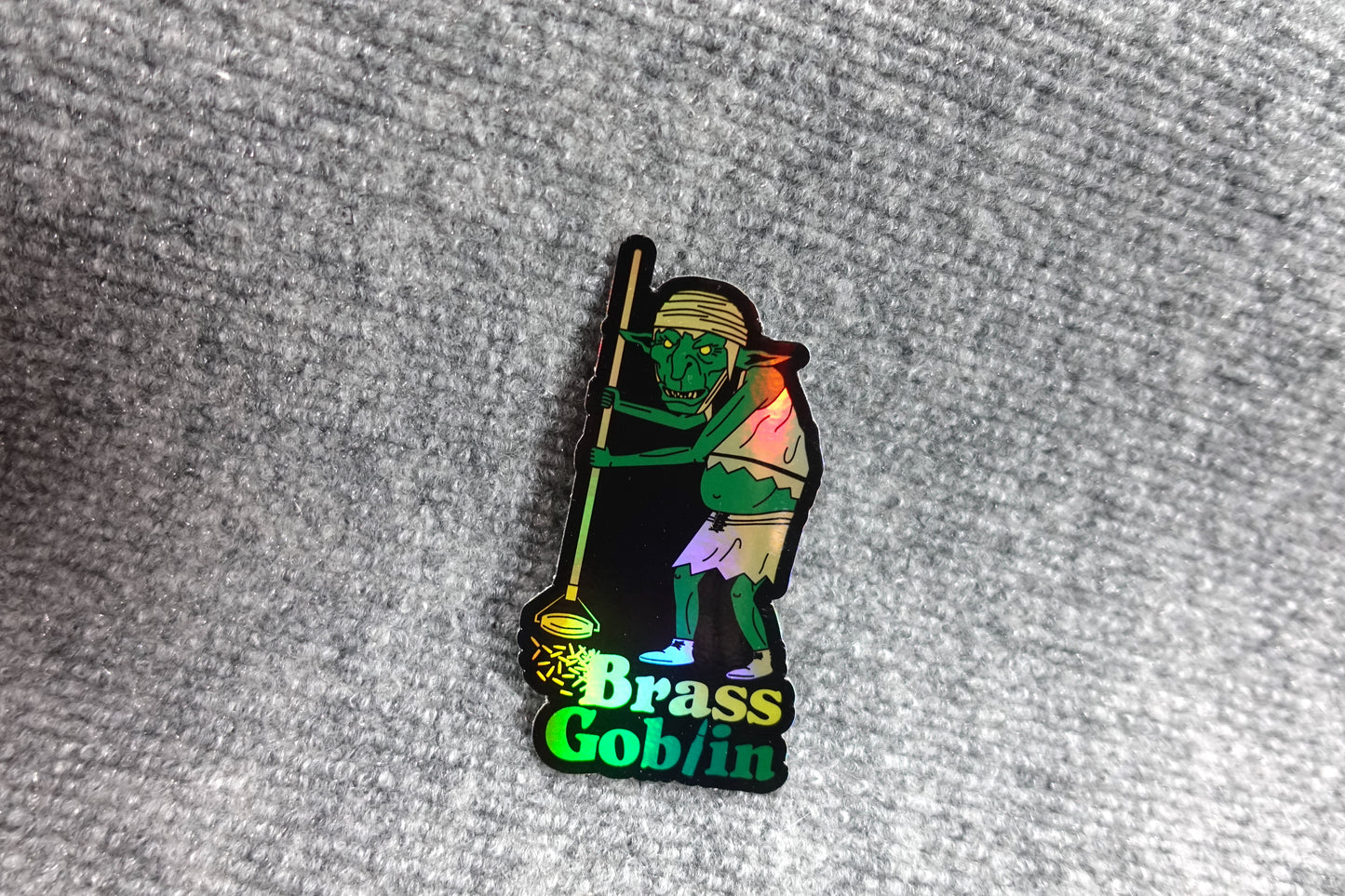 Holo Brass Goblin Slap